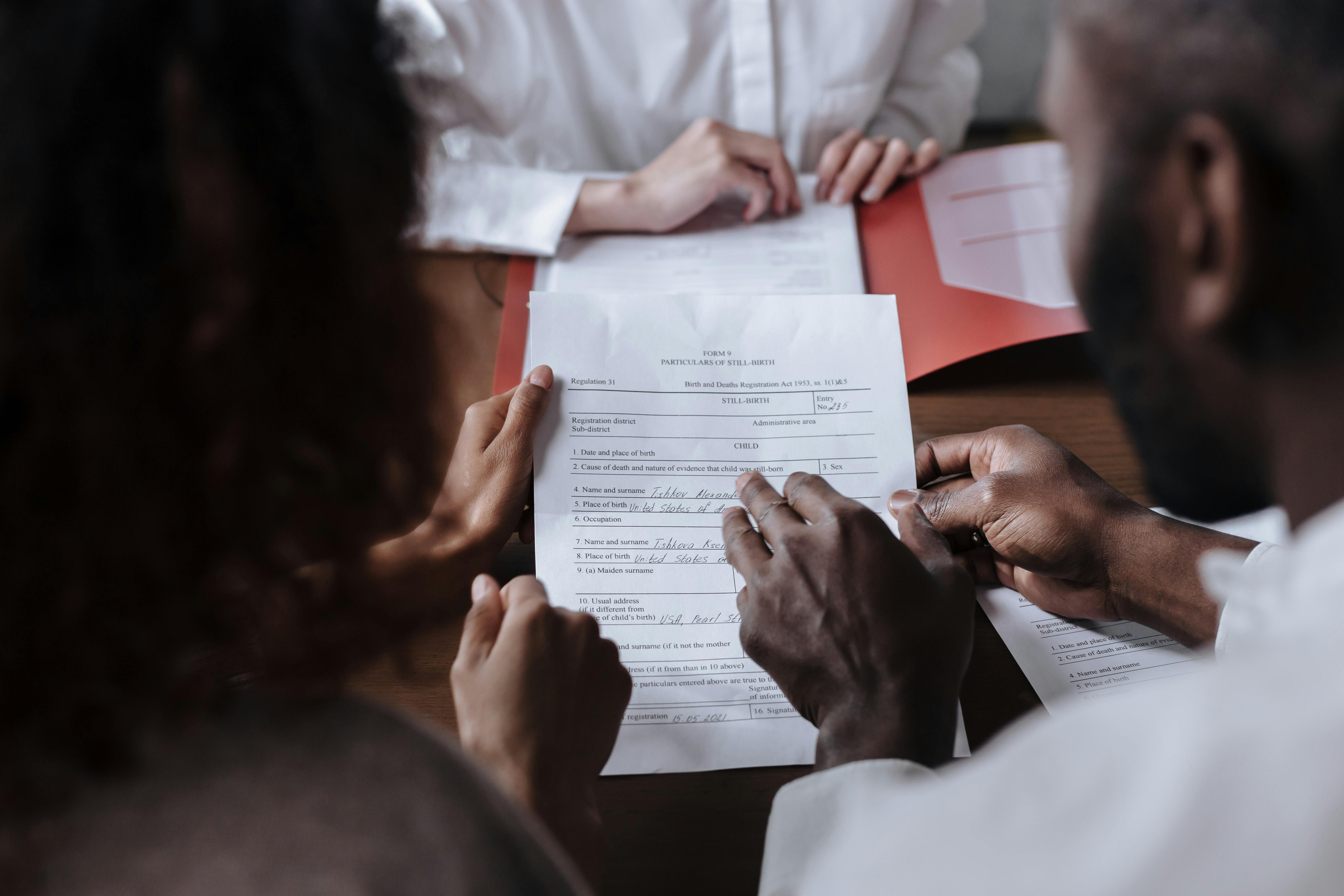 photograph of people signing a document